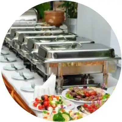 party catering food on display with food containers and plates ready for serving